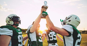 Football team holding up trophy